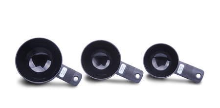 Black measuring cups isolated on white backgroundの写真素材