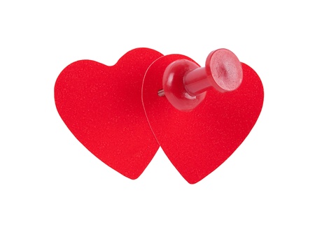 two red hearts pinned together isolated on white background