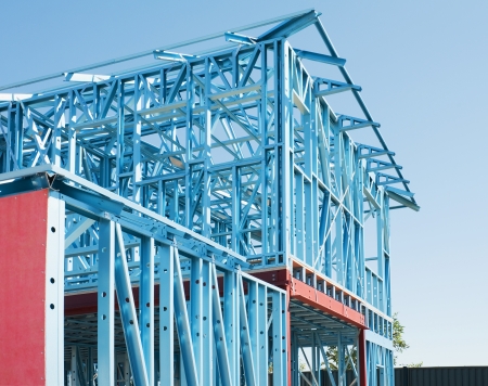 New residential construction home metal framing against a blue skyの写真素材