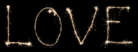 word love from sparkler isolated on black backgroundの写真素材