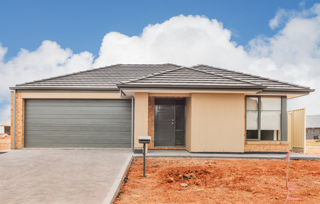 new suburban home currently under construction against cloudy skyのeditorial素材