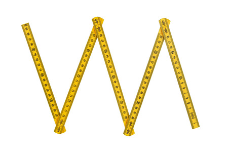 yellow plastic folding rule isolated over white background