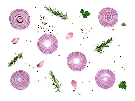 Sliced red onions set with spices and herbs isolated on white background.Top view の写真素材
