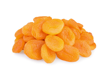 Dried pitted apricots  isolated on a white background の写真素材