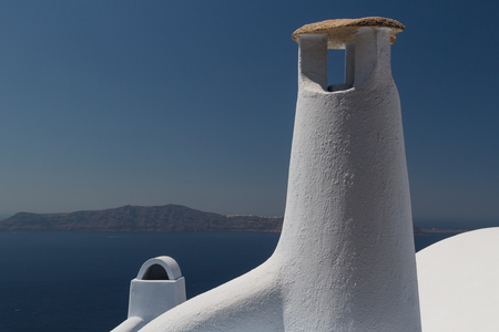 Chimney in traditional Cyclades style in Fira village, Santorini island, Greeceの写真素材