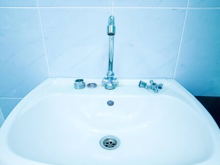 plumbing repairs in the house, old faucet and sinkの写真素材