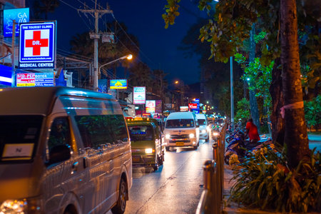 Phuket, Thailand-12.29.2018: carriageway with moving vehicles in the evening on Patong Street