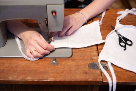 sewing medical gauze masks with a sewing machine, do-it-yourself virus protection, lack of medical...