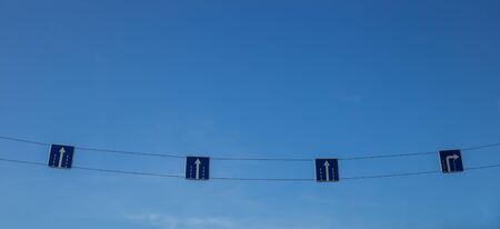 arrows direction of movement of transport on a background of blue skyの写真素材