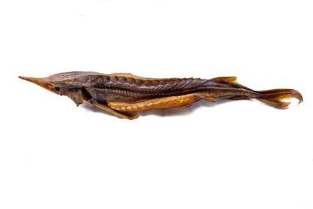 tasty smoked fish sterlet isolated on a white background, side view, gourmet appetizerの写真素材