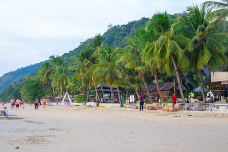 Koh Chang, Thailand-01.11.2020: sandy seashore with tourists resting, summer holidays in the tropics, white sand beachのeditorial素材