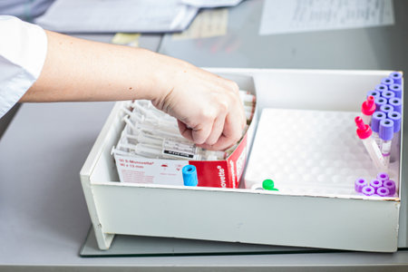 Khmao-Yugra, Russia-06.09.2020: A nurse takes a medical test tube for taking blood from a vein, diagnoses the disease, tests for coronavirus, treatment roomのeditorial素材
