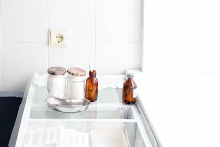 glass tables with medical instruments, cleanliness and sterility in the treatment room of the...