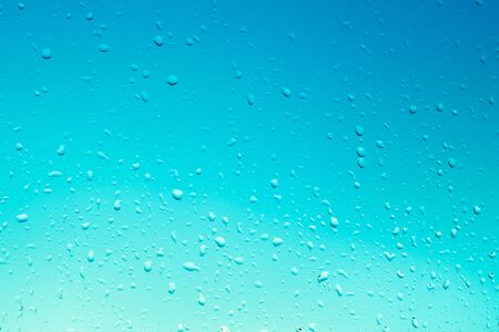 blue window glass background with raindrops, light gradient, texture, template for text