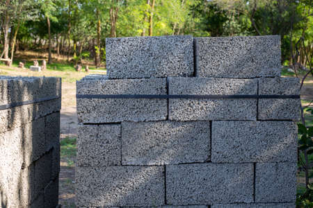 blocks of aerated concrete are neatly stacked in pallets. Construction and repair of a country...