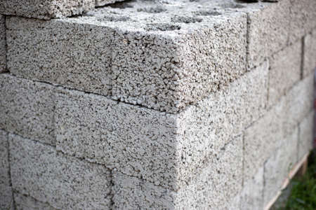 Cinder block bricks stacked on a pallet close up.