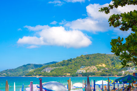 Sunny tropical resort in Thailand. Sea and mountains on Patong beach in Phuket. Travel and tourism.の写真素材