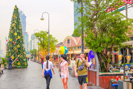 Thailand, Bangkok-24.01.2018: Tourist street of the entertainment complex Asiatic, decorated Christmas tree on New Year's holidays, walking tourists.のeditorial素材