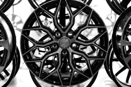 Black alloy wheels for premium cars, close-up. Purchase and replacement of autodisks.