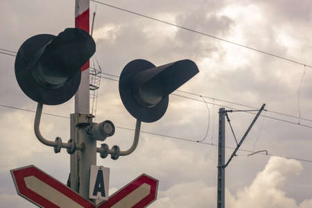 Traffic light at a railway crossing. The object of increased attention is at the intersection of the road and railways.の写真素材