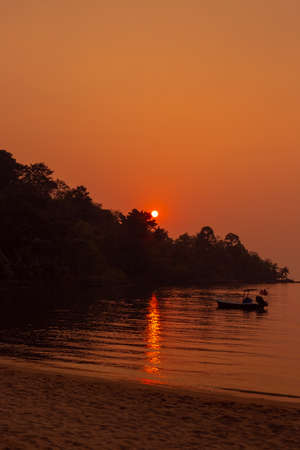 Vertical landscape. Sunset over sea and mountain on a tropical island in Thailand. Travel and tourism.の写真素材