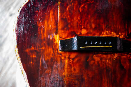 Painting an old guitar with varnish. Repair of vintage musical instruments.の写真素材