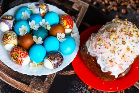 The Feast of Holy Easter. Painted eggs and Easter cakes on platters, decorated with cherry blossoms.