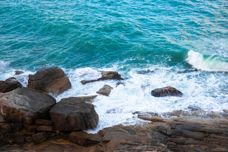 The sea wave beats on the rocks,top view. Sea rocky landscape.