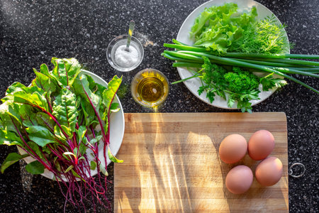 Salad from young beet leaves. Ingredients for making salad: greens, vegetables, eggs, oil, salt next...
