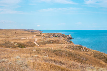 Plateau with dry grass and mountainous coast of the Sea of Azov. Seascape.の写真素材