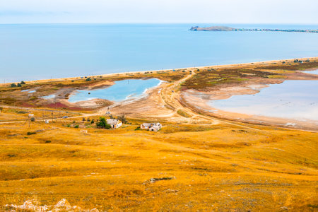 Seascape. The sea is next to the lake, separated by a narrow isthmus from the road.