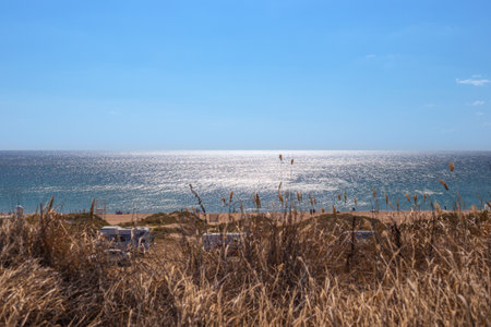 tourist camping with trailers on the seashore on a sunny autumn day. Travel and tourism.の写真素材