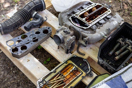 Car repair. Car intake manifold parts in disassembly.の写真素材