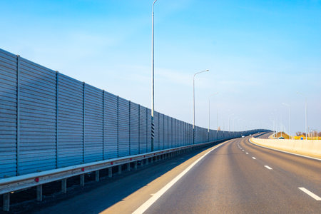 Anti-Noise screen along the road going up. Noise protection fence preventing noise pollution.