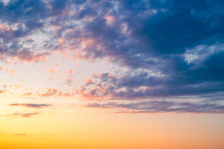 dramatic sky at sunset with a mix of purple, orange and blue hues. Skyscape.の写真素材
