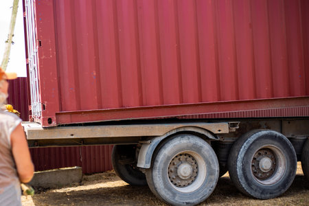 Transportation of cargo container. Removing container from trailer.の写真素材