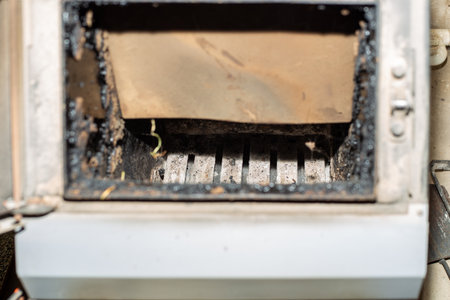 open door of solid fuel heater stove, preparing for cleaning.の写真素材