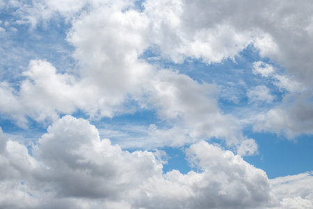 Dramatic white clouds against a deep blue sky in summer. nature background, clear sky.