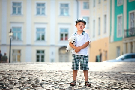 Portrait of a little boy outdoors in city の写真素材