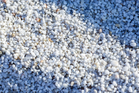 Natural white marble stones texture. Quartz pebble beach in Is Arutas beach in Sardinia. Quartz...