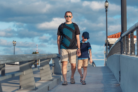Young father and son on Fort Lauderdale Bridge, Florida, USAの写真素材