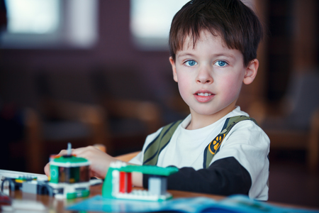 Concentrated child reading a manualの写真素材