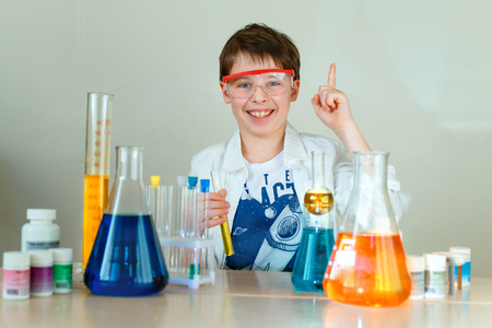 Cute boy is making science experiments in a laboratoryの写真素材