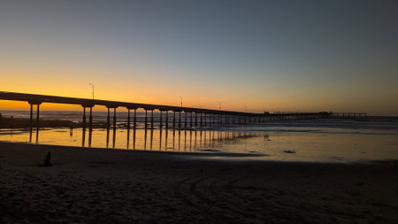 Ocean Beach Pier in San Diego California during king tides at low tide where the tidal pools are visible.の写真素材