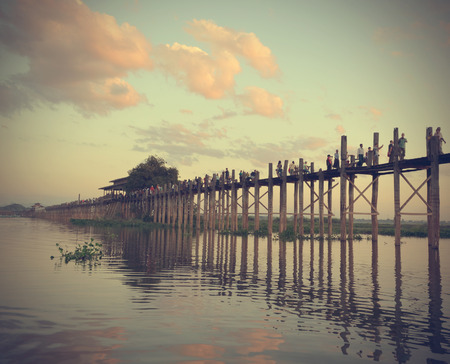 MANDALAY MYANMAR November 10, 2014. Local resident each pass, the longest wooden bridge. Silhouette Of Oban The Amarapuraの写真素材