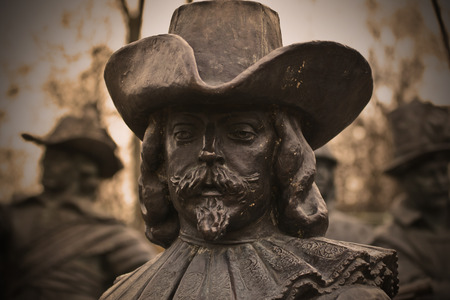 A bronze sculpture of a manの写真素材