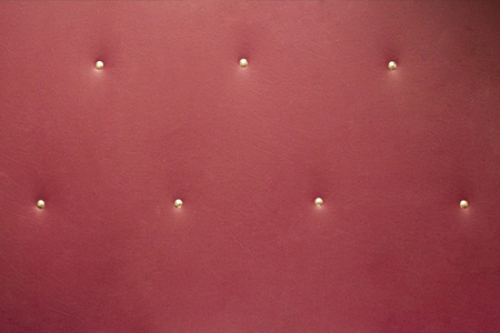 natural burgundy leather background with buttons old shabby texture vintageの写真素材