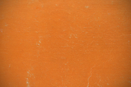 the background texture is made from the book cover orange color vignetteの写真素材