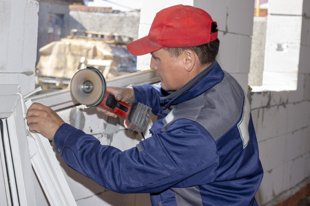 working installation plastic window working saw home construction repairの写真素材