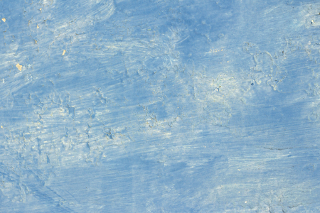 copyspace background texture blue paint with stains and popping in some placesの写真素材